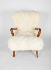 Mid-Century Danish Chair of Elm Wood and Sheepskin in the Style of Arctander