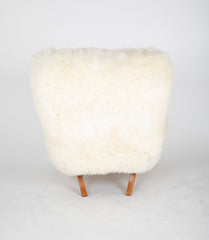 Mid-Century Danish Chair of Elm Wood and Sheepskin in the Style of Arctander