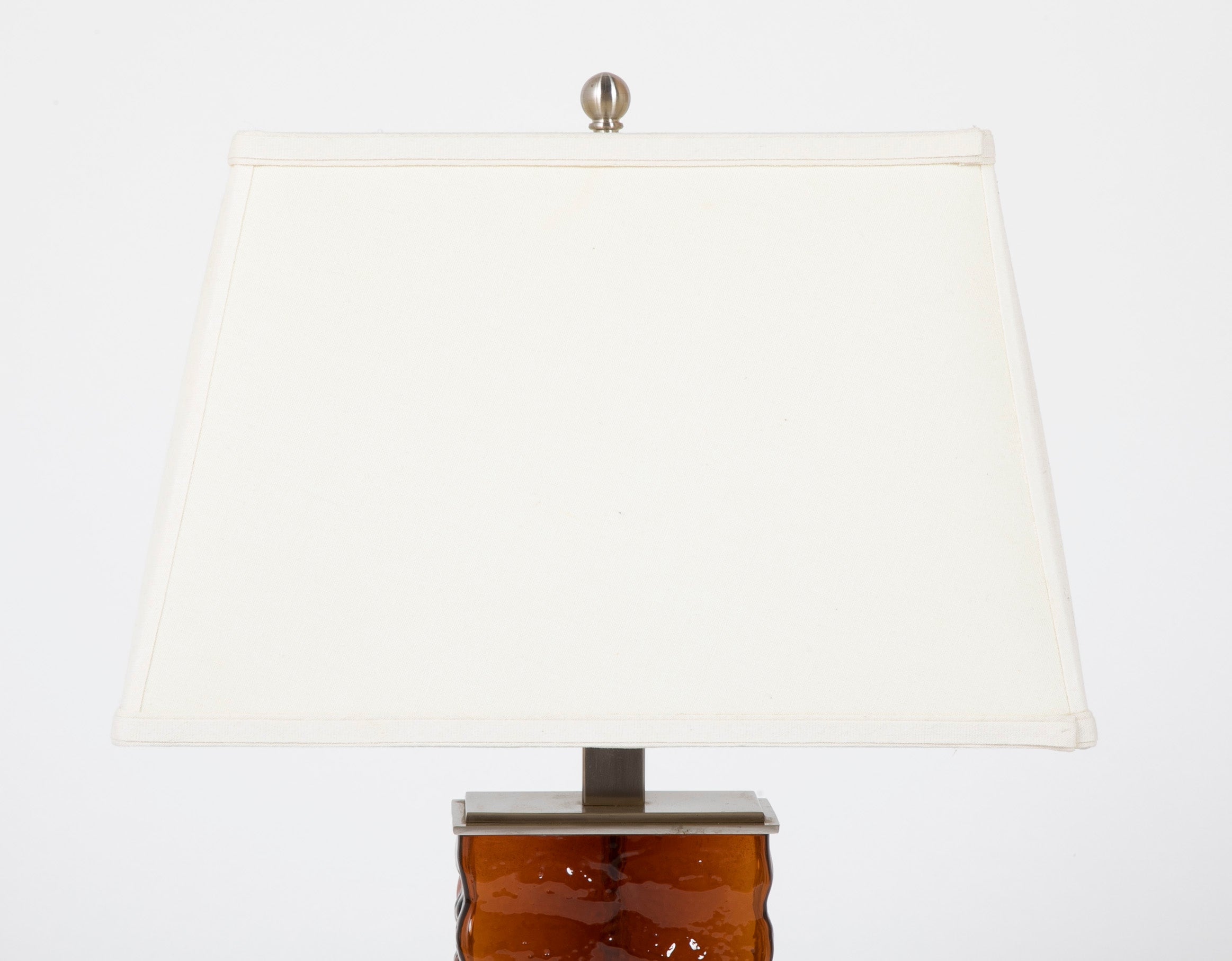 A Pair of Mid-Century Wavy Amber Glass & Steel Lamps