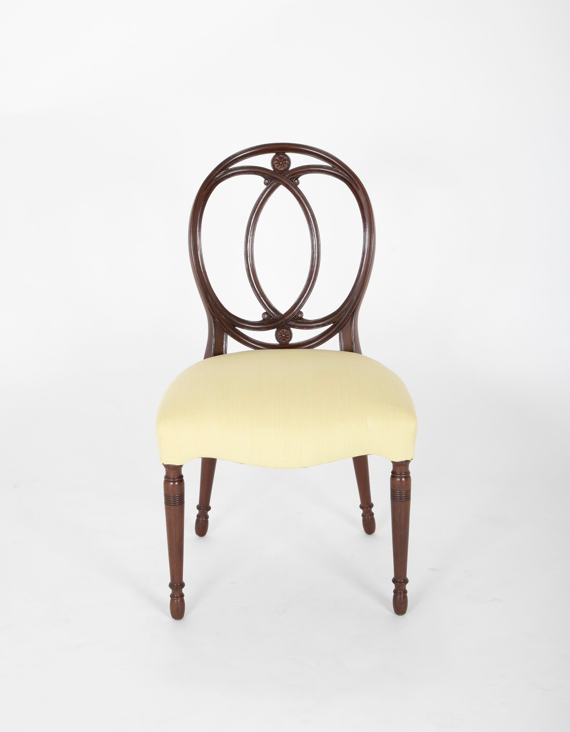 A Set of Eight Mahogany Balloon Back Dining Chairs