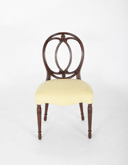 A Set of Eight Mahogany Balloon Back Dining Chairs
