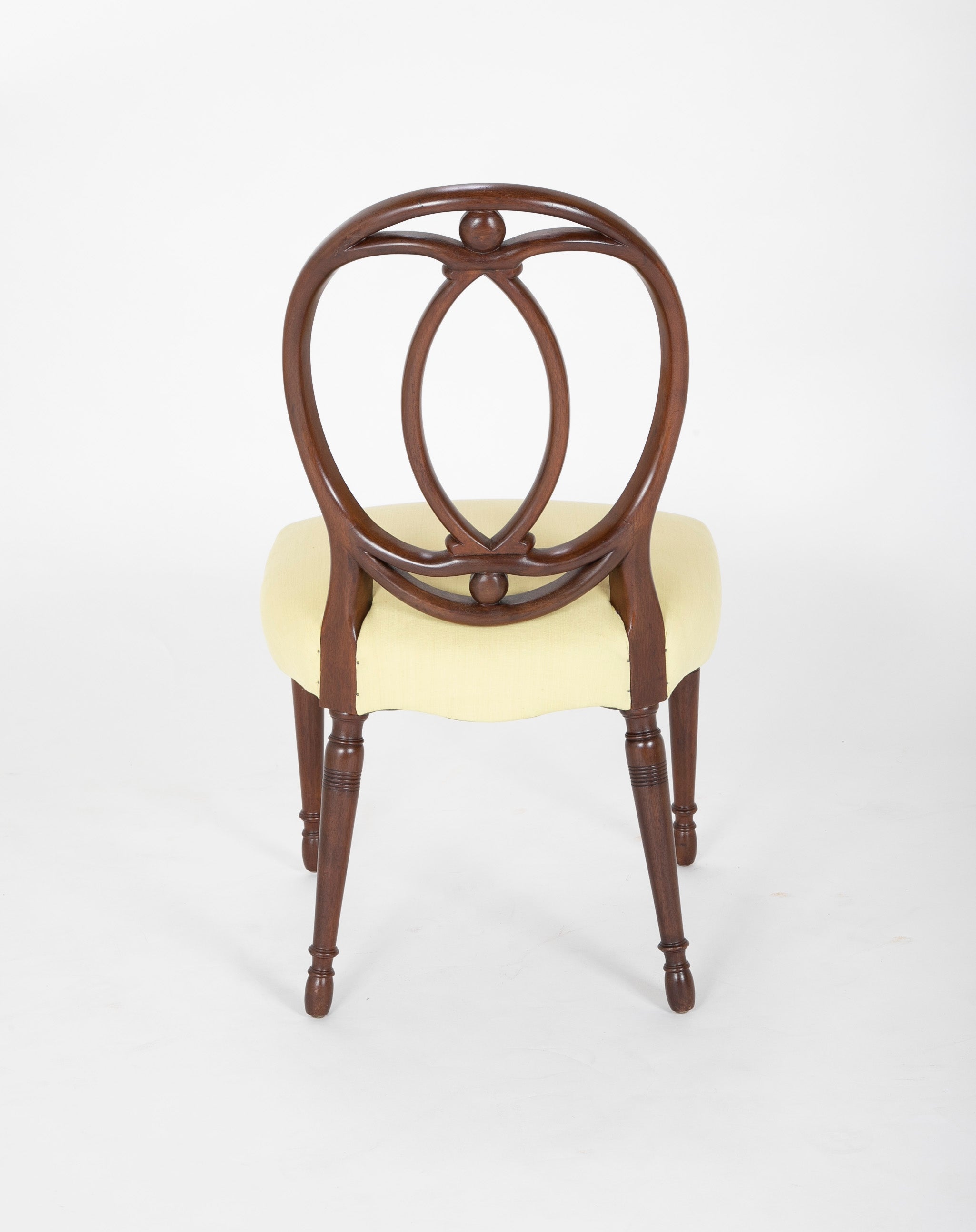 A Set of Eight Mahogany Balloon Back Dining Chairs