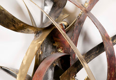 Mixed Metal Wall Sculpture titled "Saturn's Rings" by Silas Seandel