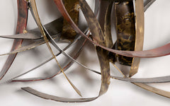 Mixed Metal Wall Sculpture titled "Saturn's Rings" by Silas Seandel