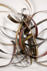 Mixed Metal Wall Sculpture titled "Saturn's Rings" by Silas Seandel
