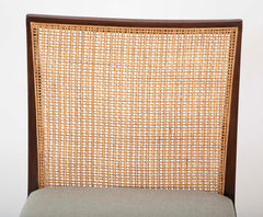 A Set of Eight Walnut and Caned Dining Chairs Designed by Edward Wormley.