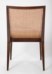 A Set of Eight Walnut and Caned Dining Chairs Designed by Edward Wormley.