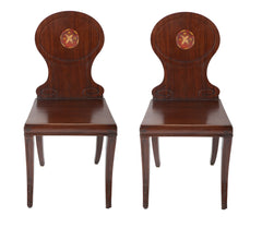 A Pair of Late Georgian Mahogany and Polychrome Hall Chairs