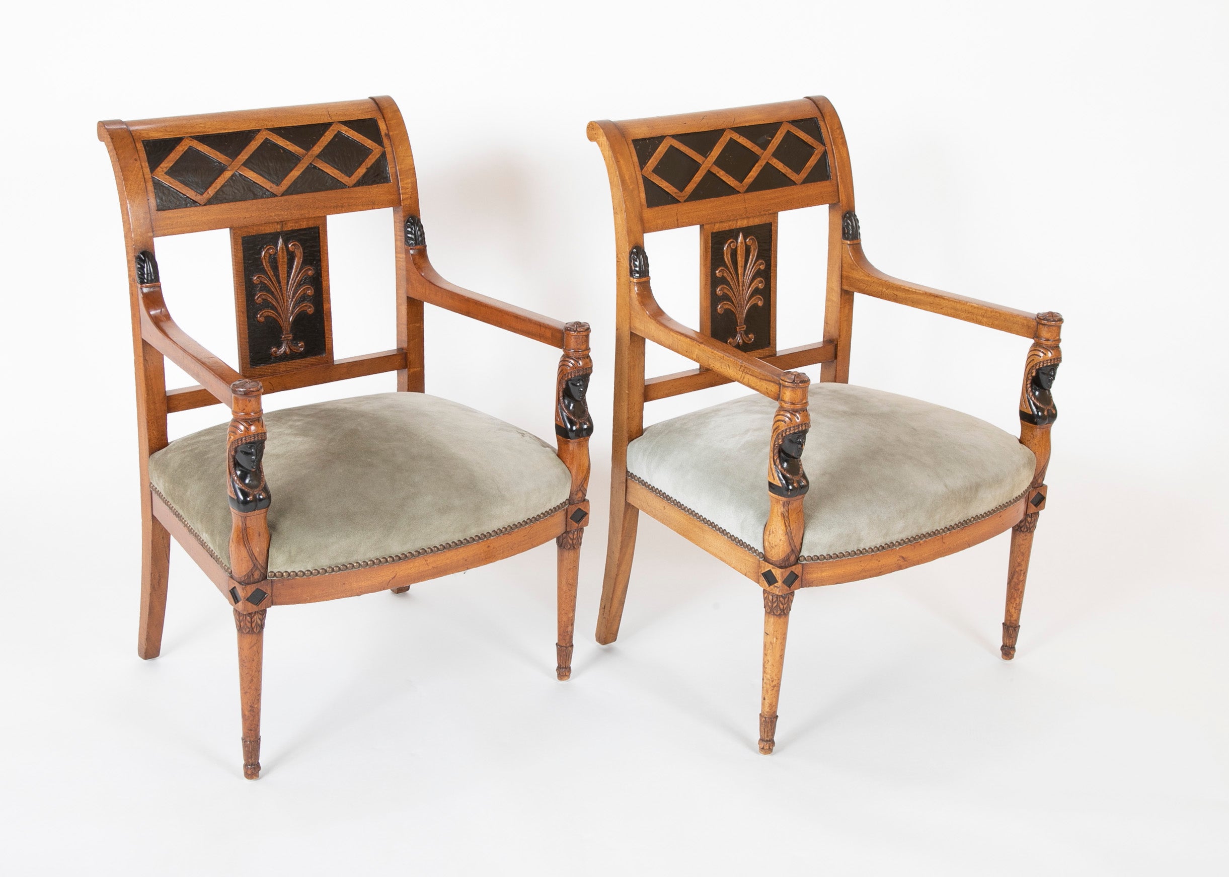 A Pair of Continental Neoclassical Chairs with Carved Egyptian Head on the Arm