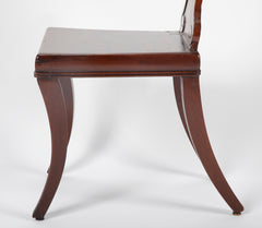 A Pair of Late Georgian Mahogany and Polychrome Hall Chairs