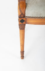 A Pair of Continental Neoclassical Chairs with Carved Egyptian Head on the Arm