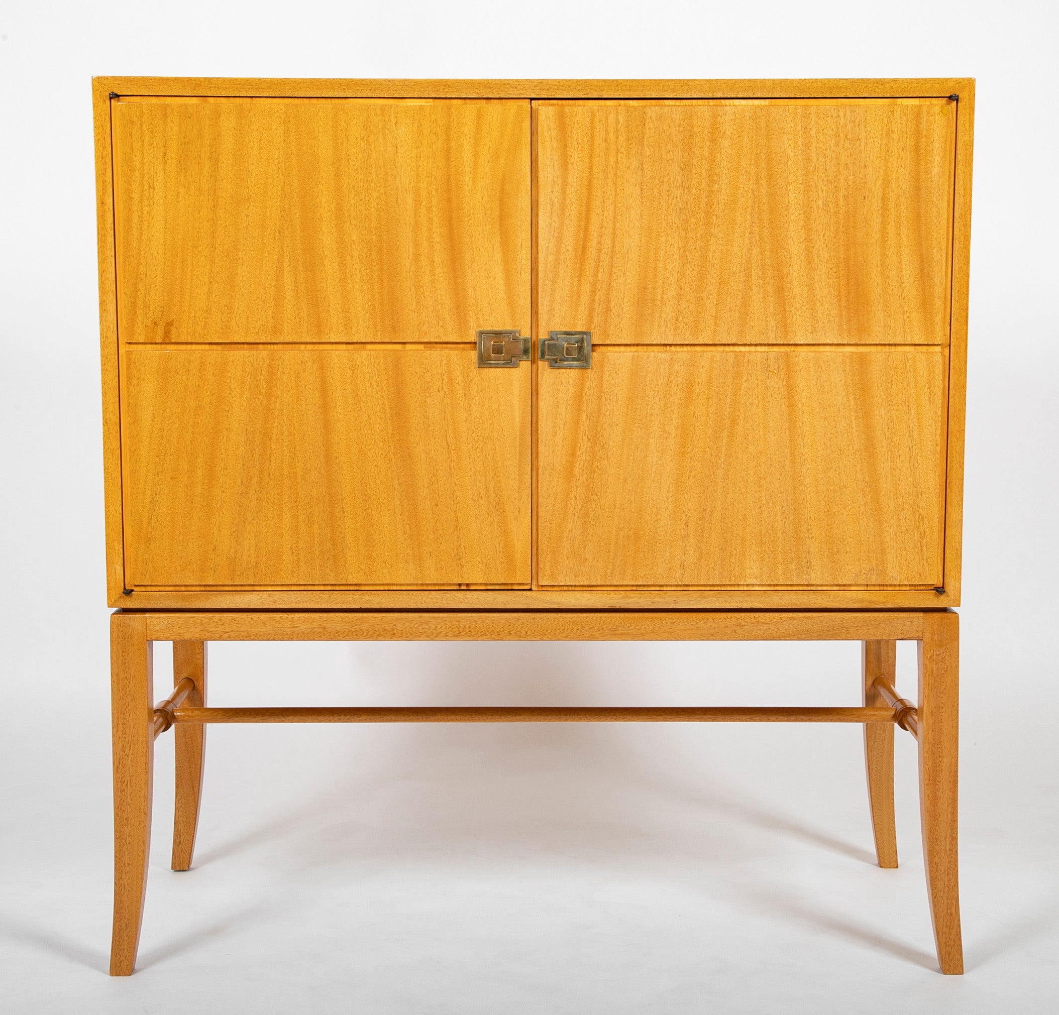 A Tommi Parzinger cabinet with 3 interior drawers