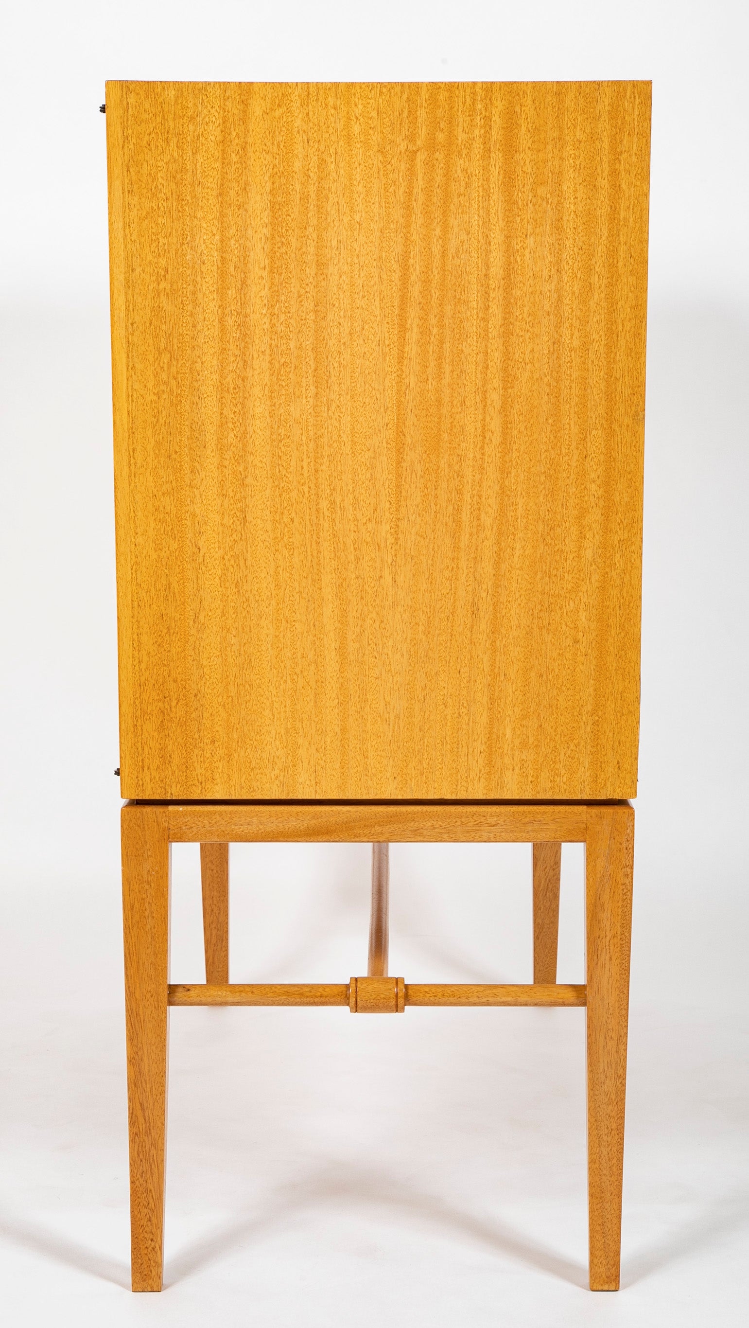 A Tommi Parzinger cabinet with 3 interior drawers