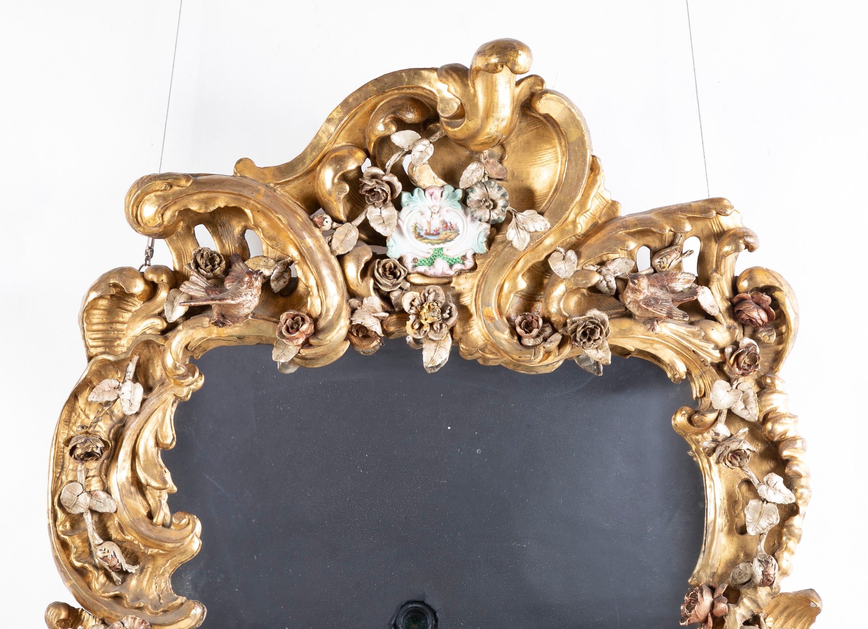 Rare Rococo German Giltwood Carved Mirror with Porcelain Medallions Insets