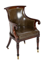 A Mahogany Library Chair with Curled & Carved Crest Upholstered in Leather