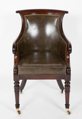 A Mahogany Library Chair with Curled & Carved Crest Upholstered in Leather