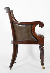 A Mahogany Library Chair with Curled & Carved Crest Upholstered in Leather
