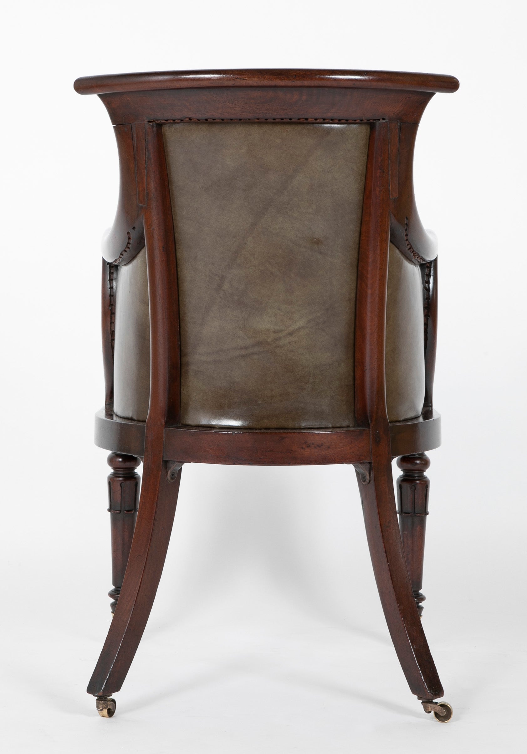 A Mahogany Library Chair with Curled & Carved Crest Upholstered in Leather