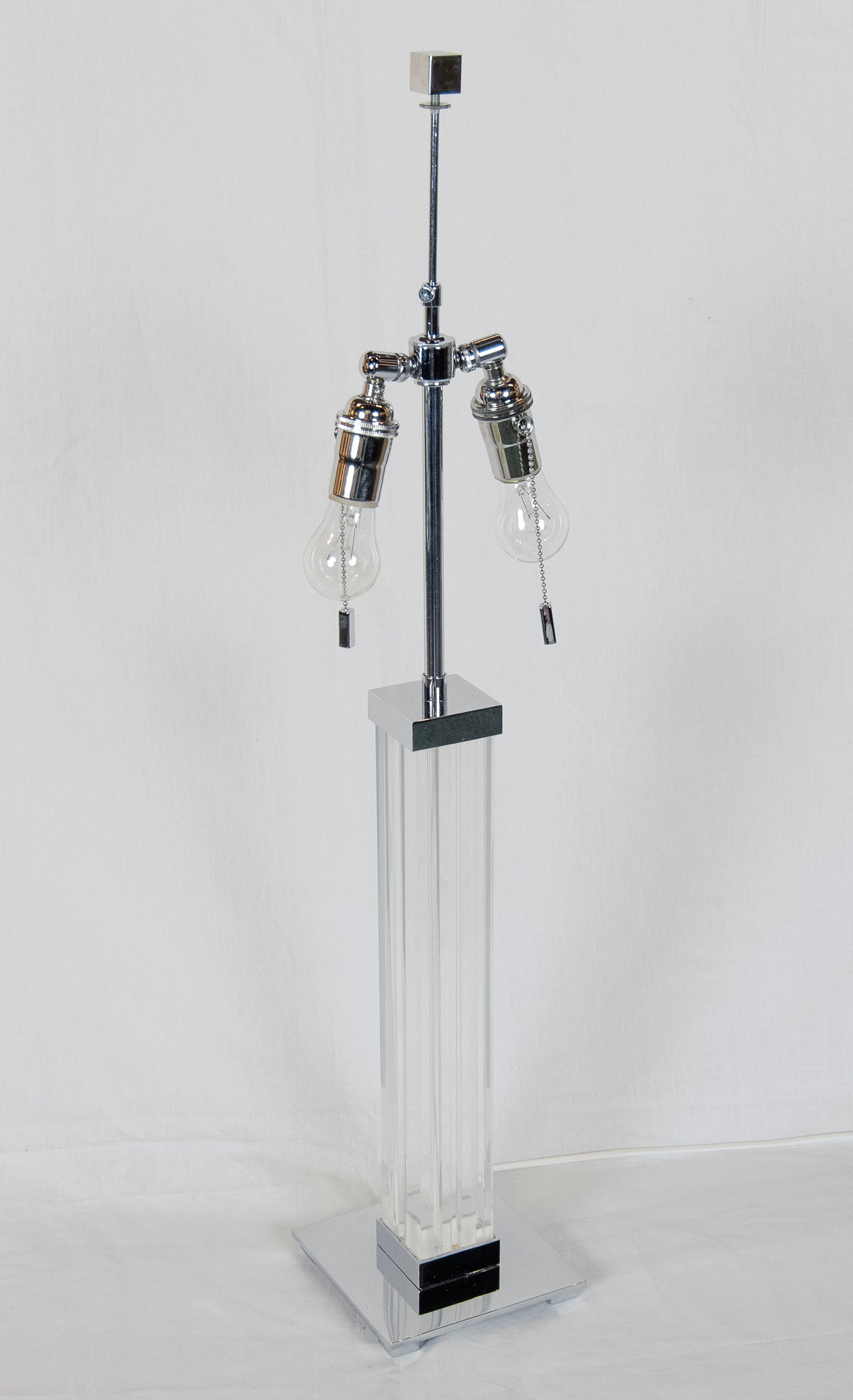 A Pair of Karl Springer Lucite and Chrome Table Lamps