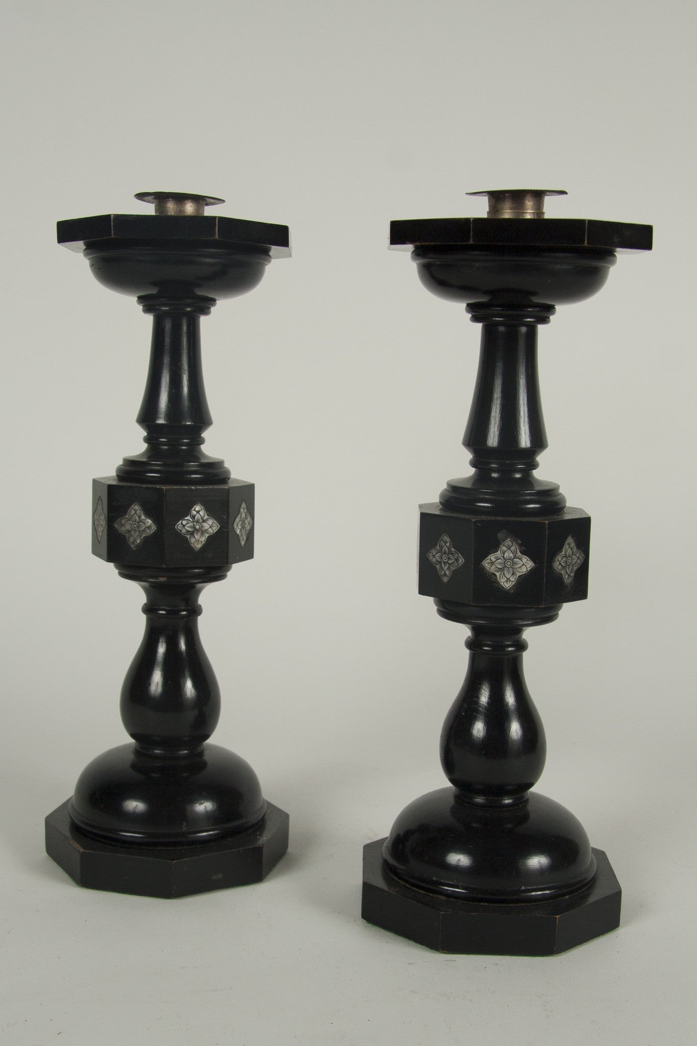 A Pair of Cotswold School Ebonized Candlesticks