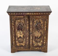 A Chinese Two Door Black Lacquered Table Top Chest