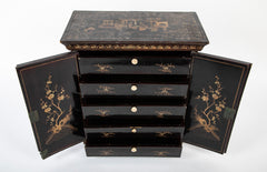 A Chinese Two Door Black Lacquered Table Top Chest