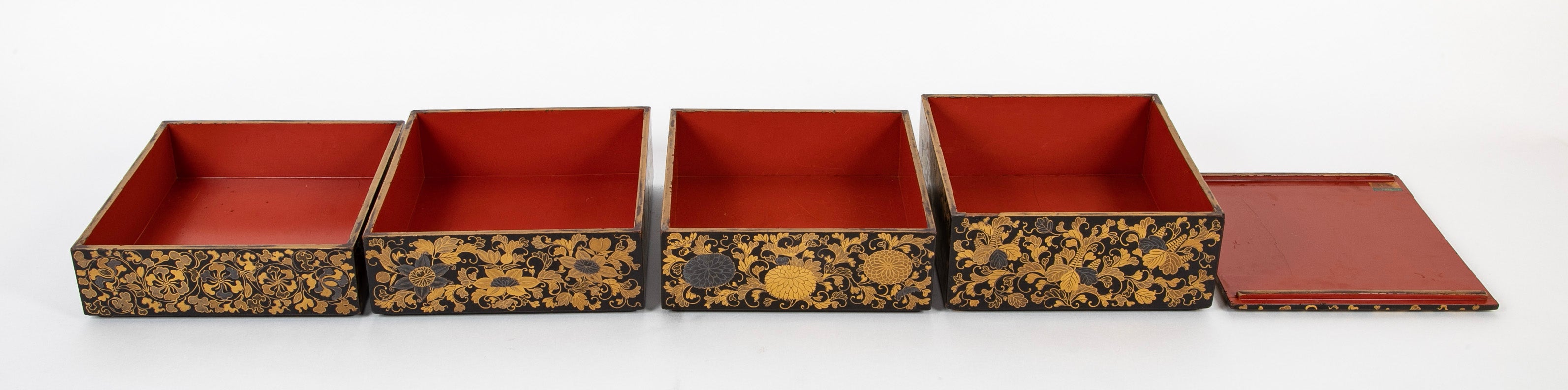 A Japanese Black Lacquer 4 Tier Bento Box with Gilt Floral Designs