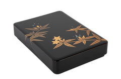 A Wajima Lacquered Covered Box with Gilt Leaf Decoration
