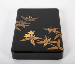 A Wajima Lacquered Covered Box with Gilt Leaf Decoration