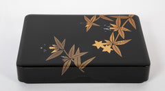 A Wajima Lacquered Covered Box with Gilt Leaf Decoration
