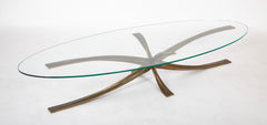 A Oval Glass And Bronze Coffee Table Designed by Michel Mangematin