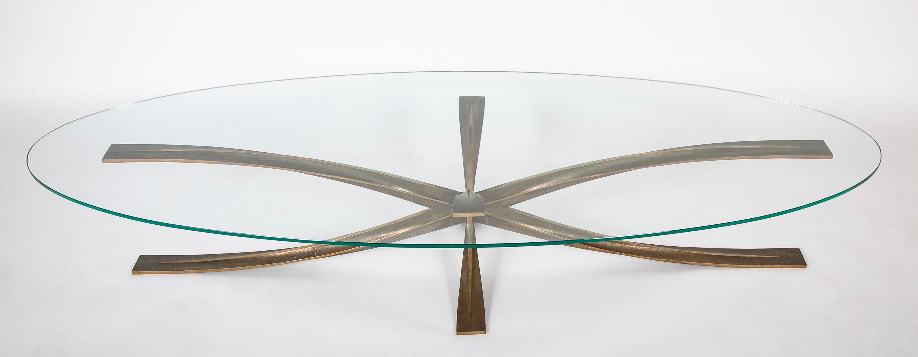 A Oval Glass And Bronze Coffee Table Designed by Michel Mangematin