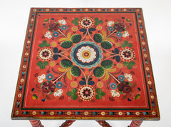 A Red Norwegian Table with Colorful Floral Painted Decoration