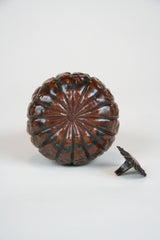 A Japanese Repousse Copper Scroll Weight in the Form of a Gourd