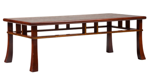 A Japanese style coffee table with rusticated top