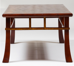 A Japanese style coffee table with rusticated top