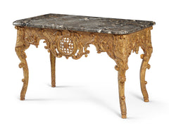 A Large Marble Top Regence Period Console In Gilded and Sculpted Wood