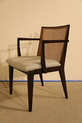 A Set of Eight Walnut and Caned Dining Chairs Designed by Edward Wormley.